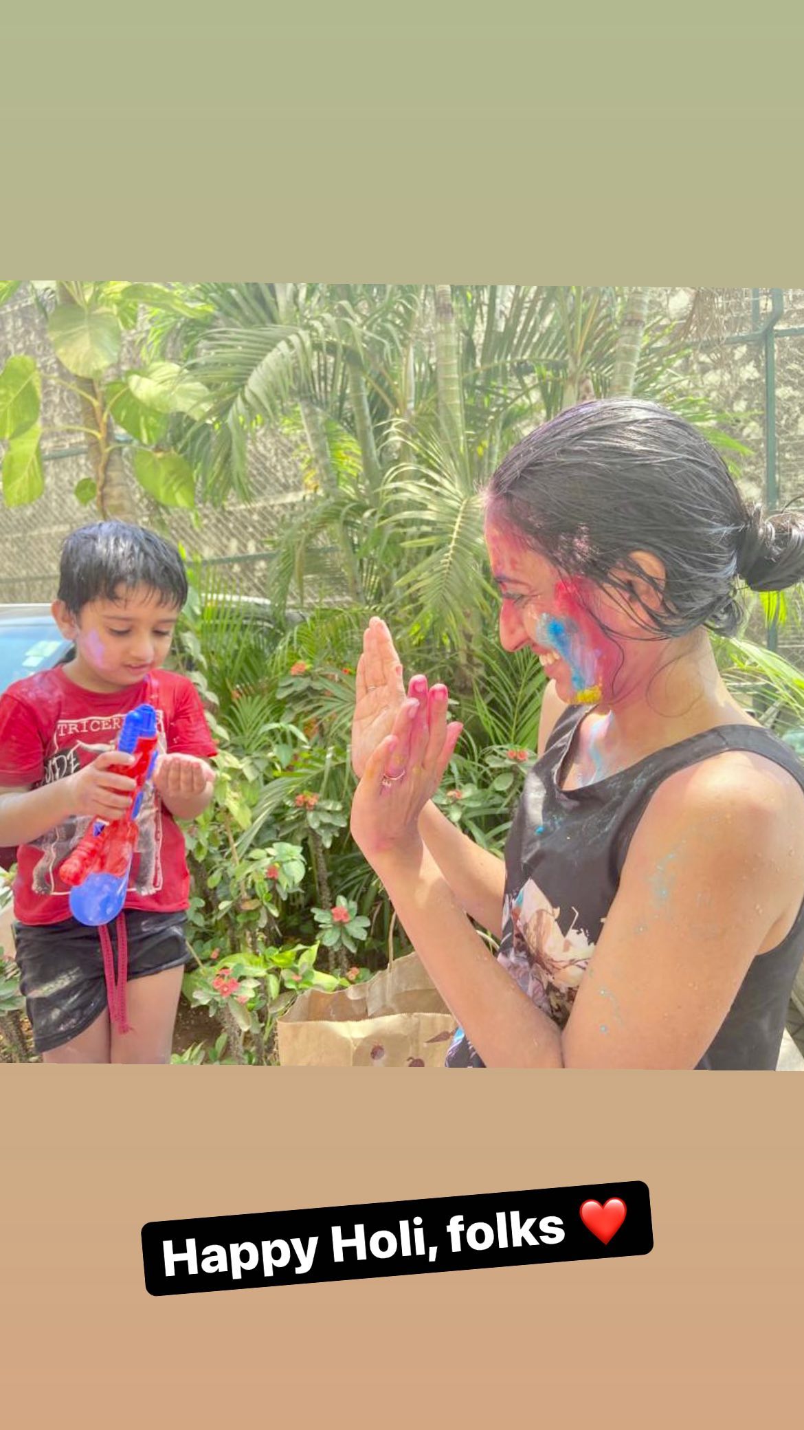 Vineeta Singh celebrates holi with her son.