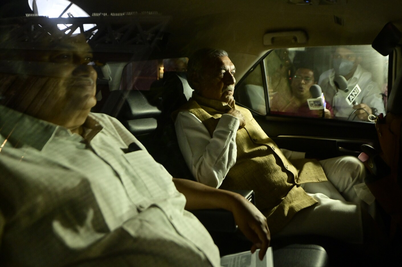 Congress leaders Bhupinder Singh Hooda and Kuldeep Sharma leave from the residence of party leader Ghulam Nabi Azad, after the Congress G-23 leaders' meeting , in New Delhi, Wednesday, March 16, 2022. (PTI Photo/Ravi Choudhary)