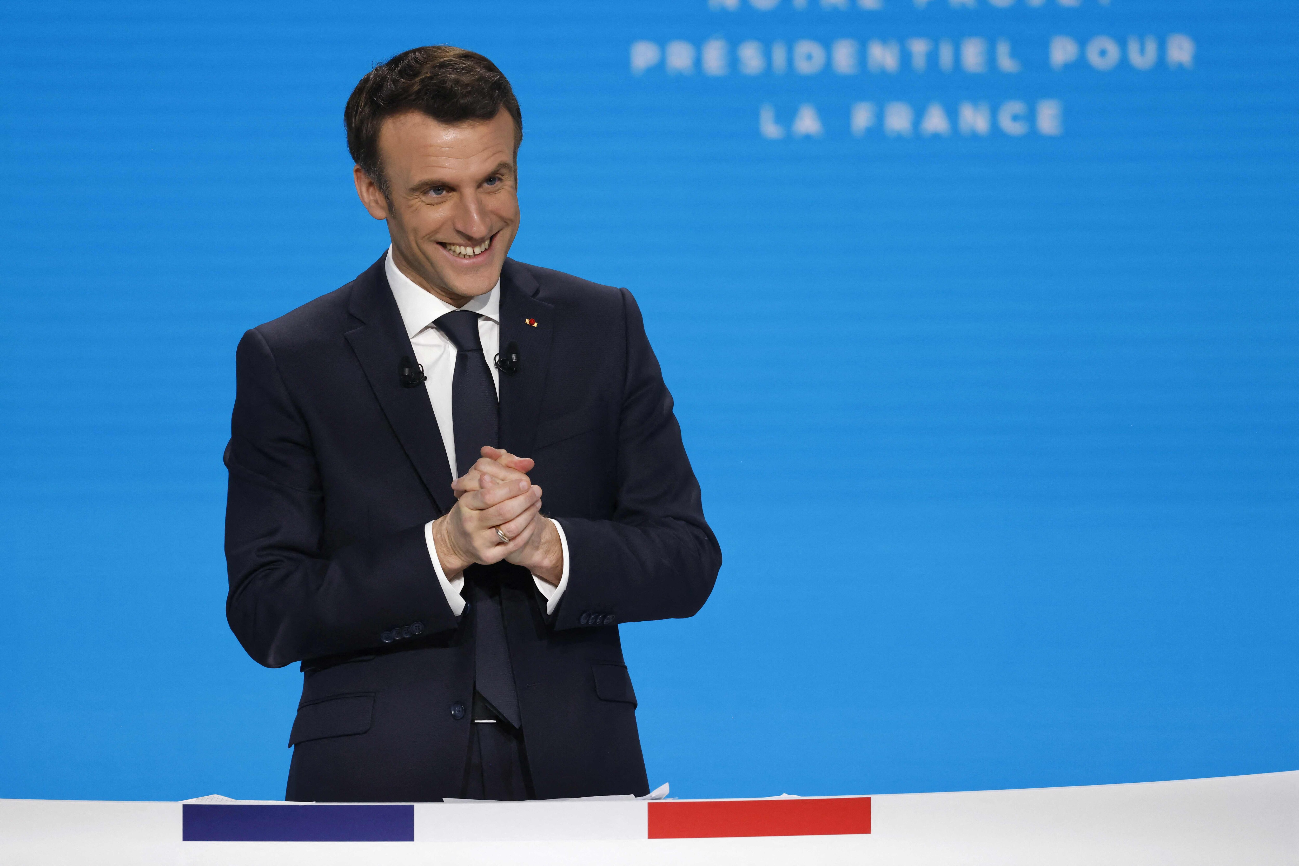 France's President Emmanuel Macron, and French liberal party La Republique en Marche (LREM) candidate to his succession reacts during a press conference to present his political programme ahead of the April 10/24 presidential election in France, in the Paris' suburban city of Aubervilliers, on March 17, 2022. (Photo by Ludovic MARIN / AFP) France's President Emmanuel Macron, and French liberal party La Republique en Marche (LREM) candidate to his succession reacts during a press conference to present his political programme ahead of the April 10/24 presidential election in France, in the Paris' suburban city of Aubervilliers, on March 17, 2022. (Photo by Ludovic MARIN / AFP)