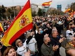 People hold Spanish flags as they take part in a demonstration organised by Spanish far-right party Vox, to protest against energy price hikes, in Madrid, Spain, March 19, 2022. (REUTERS/Susana Vera)