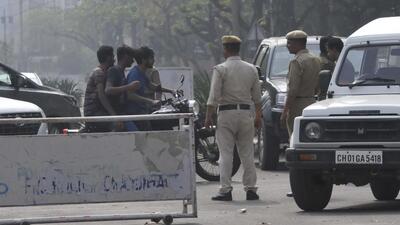 Police personnel stopping traffic violators at Panjab University during Holi celebrations in Chandigarh on Friday. (Keshav Singh/HT) Police personnel stopping traffic violators at Panjab University during Holi celebrations in Chandigarh on Friday. (Keshav Singh/HT)