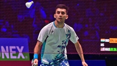 India's Lakshya Sen eyes the shuttlecock as he competes against Malaysia's Lee Zii Jia during their men's singles semifinal match at the All England Open Badminton Championships in Birmingham, England, , Saturday, March 19, 2022. (AP) India's Lakshya Sen eyes the shuttlecock as he competes against Malaysia's Lee Zii Jia during their men's singles semifinal match at the All England Open Badminton Championships in Birmingham, England, , Saturday, March 19, 2022. (AP)