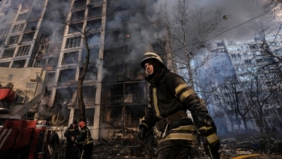 A firefighter walks outside a destroyed apartment building after a bombing in a residential area in Kyiv, Ukraine, Tuesday. (AP) A firefighter walks outside a destroyed apartment building after a bombing in a residential area in Kyiv, Ukraine, Tuesday. (AP)
