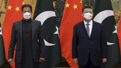 China’s Xi Jinping and Pakistan Prime Minister Imran Khan pose for a photo before their bilateral meeting at the Great Hall of the People in Beijing. (AP)