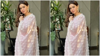 Aamna paired a georgette chikankari kurta with a pair of cotton pastel pink trousers. She completed her look with a pastel pink dupatta intricately embroidered in white resham threads. (Instagram/@aamnasharifofficial)