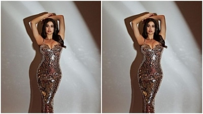 Styled by fashion stylist Tanya Ghavri, Janhvi wore her long tresses open in wavy curls with a middle part as she posed for the pictures. (Instagram/@janhvikapoor)