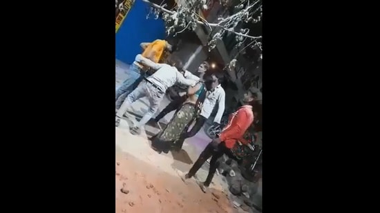Man stabs himself while dancing during Holika Dahan ritual.