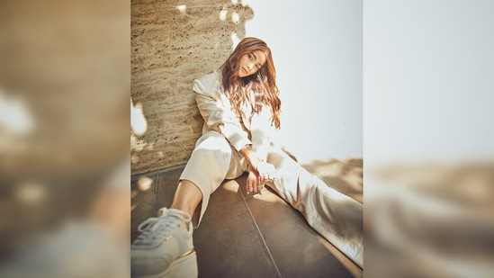 Pooja Hegde kept her look casual by teaming it with off-white sneakers and a small Louis Vuitton bag.(Instagram/@hegdepooja)