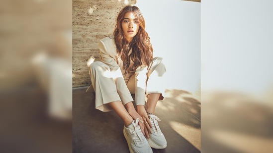 Pooja Hegde sat on the floor, looked at the lens and struck a cool pose for the camera.(Instagram/@hegdepooja)