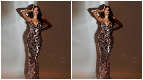 Janhvi’s slip-in gown came in shades of silver and maroon glass work and midriff-baring details.(Instagram/@janhvikapoor)