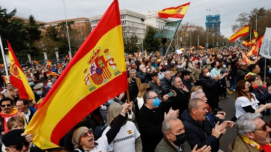 People hold Spanish flags as they take part in a demonstration organised by Spanish far-right party Vox, to protest against energy price hikes, in Madrid, Spain, March 19, 2022. (REUTERS/Susana Vera)