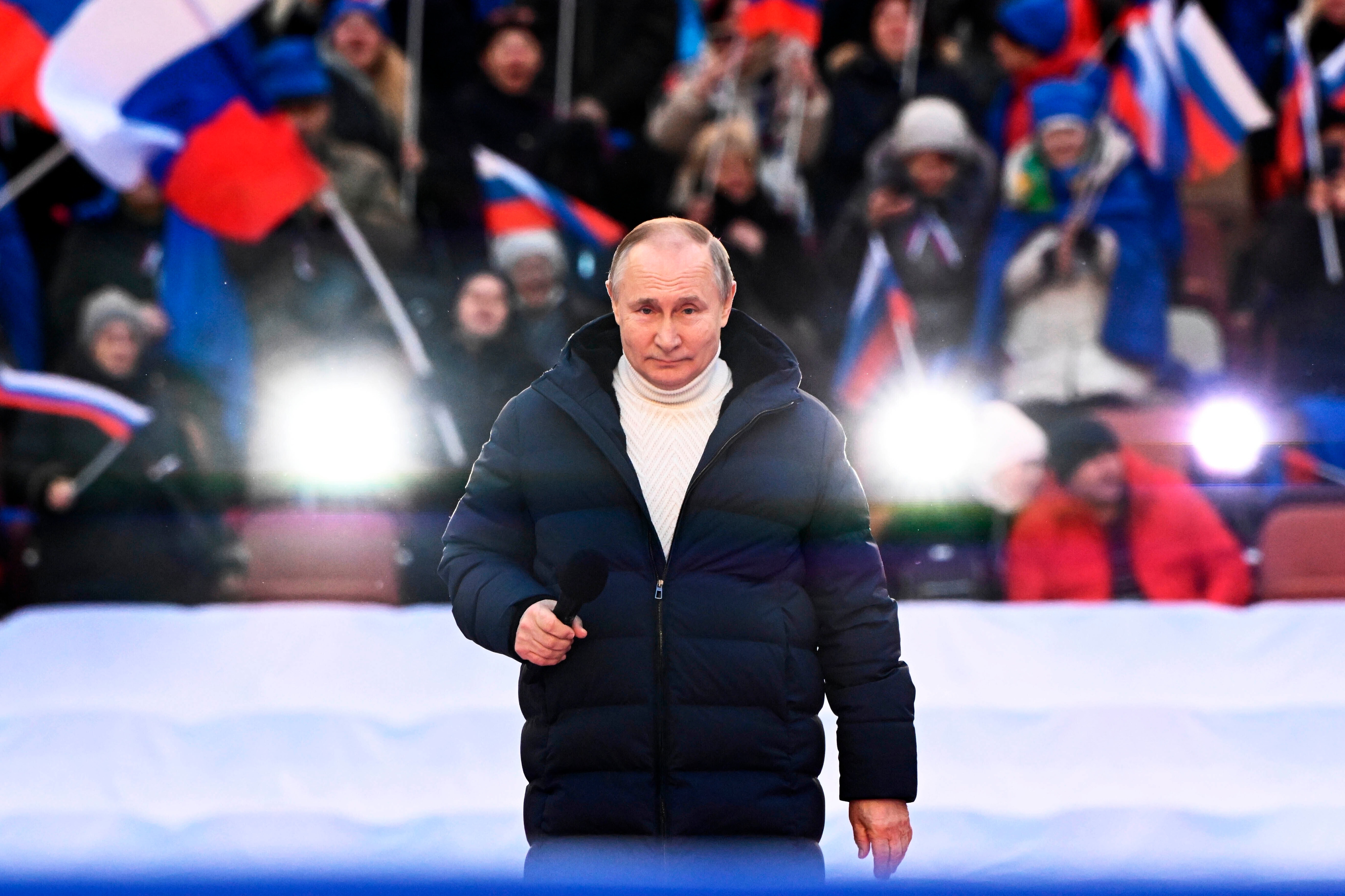 As Russian troops rained lethal fire on Ukrainian cities, Vladimir Putin appeared at a huge flag-waving rally to lavish praise on his Russian forces, while Ukrainian’s president accused the Kremlin of deliberately creating “a humanitarian catastrophe.” (AP)