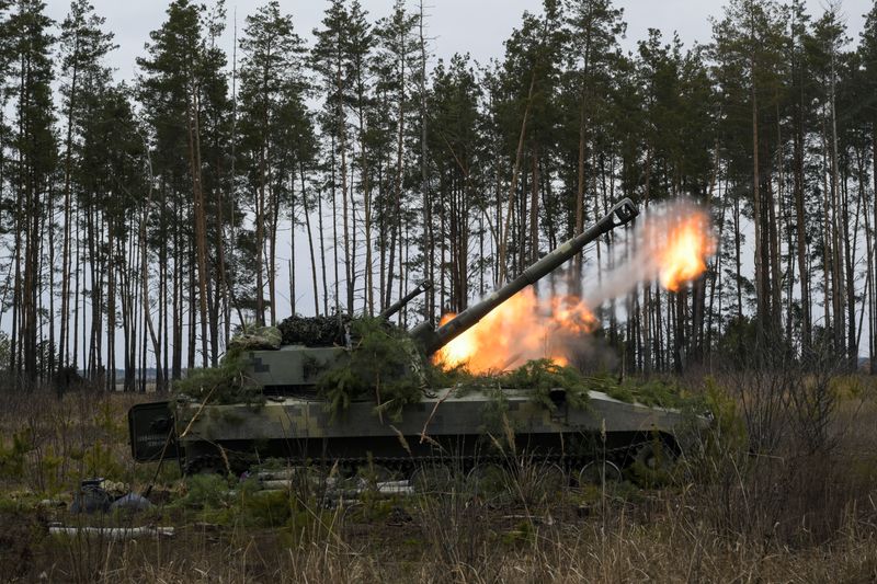 Ukrainian armed forces self-propelled howitzers fire at positions following Russia's invasion of Ukraine, near the settlement of Makariv, Ukraine (Reuters)