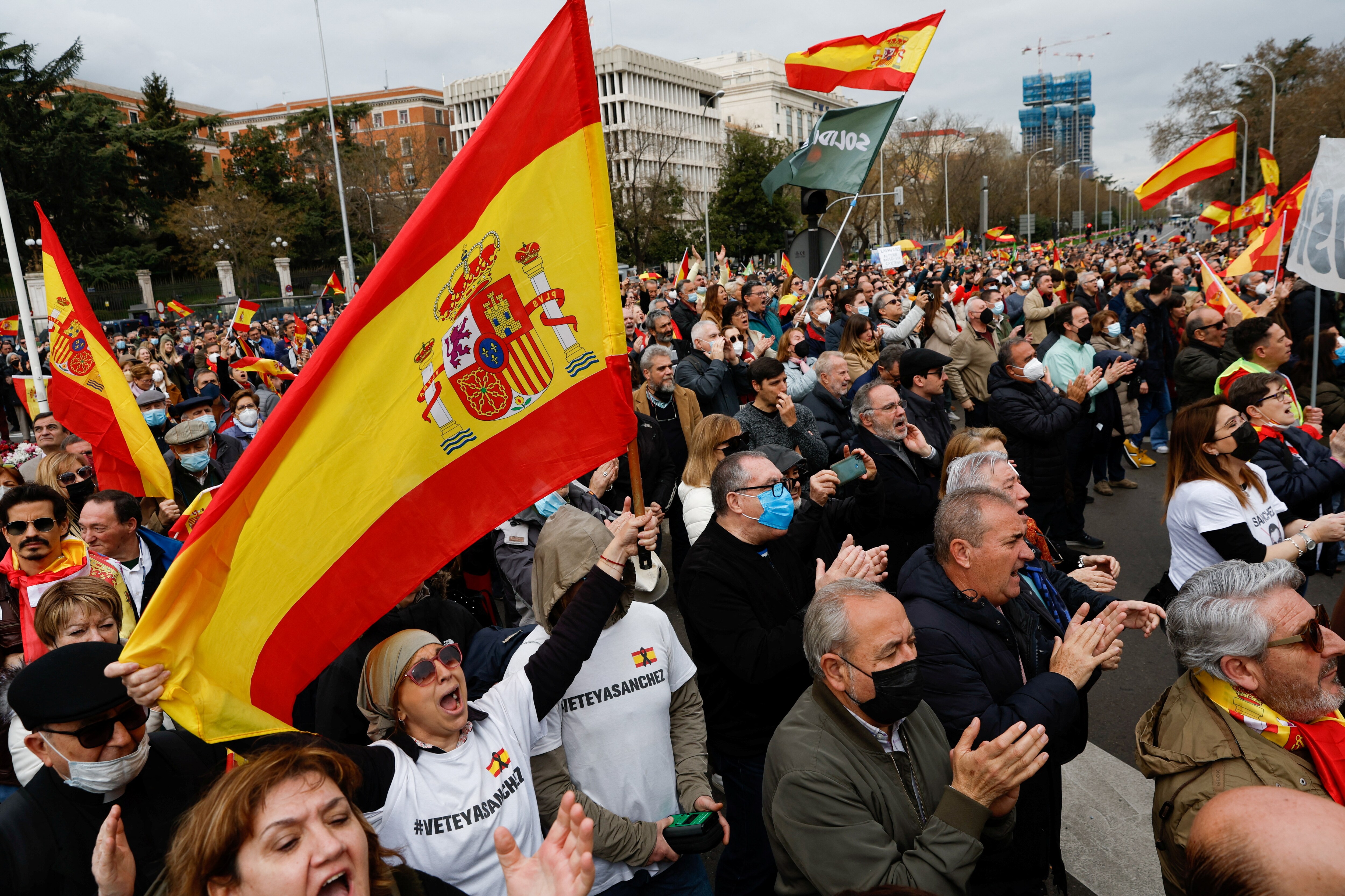People hold Spanish flags as they take part in a demonstration organised by Spanish far-right party Vox, to protest against energy price hikes, in Madrid, Spain, March 19, 2022. (REUTERS/Susana Vera)