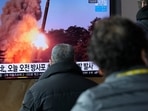 People in Seoul watch a news showing a file image of North Korea's rocket launch,&nbsp;
