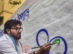 Kolkata: Babul Supriyo, former union minister & TMC candidate for Ballygunge Assembly constituency by elections, paints party symbol on a wall, in Kolkata, (PTI) Kolkata: Babul Supriyo, former union minister & TMC candidate for Ballygunge Assembly constituency by elections, paints party symbol on a wall, in Kolkata, (PTI)