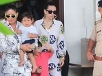 Taimur Ali Khan waves at a cop.