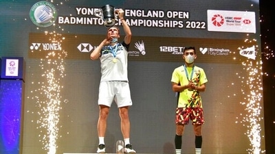 Viktor Axelsen, left, celebrates with his trophy on the podium after his victory over India's Lakshya Sen, right, in their men's singles final match at the All England Open Badminton Championships in Birmingham, England. (AP) Viktor Axelsen, left, celebrates with his trophy on the podium after his victory over India's Lakshya Sen, right, in their men's singles final match at the All England Open Badminton Championships in Birmingham, England. (AP)