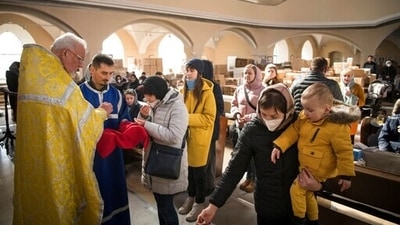 Members of the Ukrainian Orthodox community, who have found shelter for their church service in an evangelical church, and refugees from Ukraine celebrate a church service and pray for peace in Berlin. (AP) Members of the Ukrainian Orthodox community, who have found shelter for their church service in an evangelical church, and refugees from Ukraine celebrate a church service and pray for peace in Berlin. (AP)