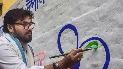 Kolkata: Babul Supriyo, former union minister & TMC candidate for Ballygunge Assembly constituency by elections, paints party symbol on a wall, in Kolkata, (PTI) Kolkata: Babul Supriyo, former union minister & TMC candidate for Ballygunge Assembly constituency by elections, paints party symbol on a wall, in Kolkata, (PTI)
