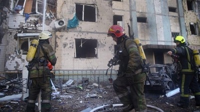 Rescuers work at the site where a residential building has been damaged by an airstrike, as Russia's attack on Ukraine continues, in Kyiv, Ukraine. (via REUTERS)
