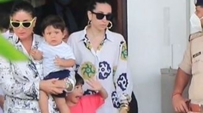 Taimur Ali Khan waves at a cop.