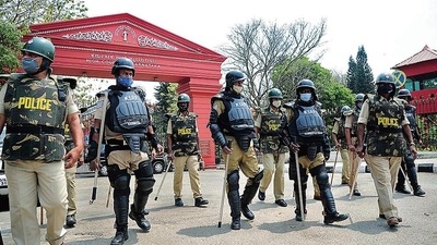 Police personnel patrolling in front of Karnataka High Court following the verdict of Hijab issue, in Bengaluru on Tuesday. Police personnel patrolling in front of Karnataka High Court following the verdict of Hijab issue, in Bengaluru on Tuesday.