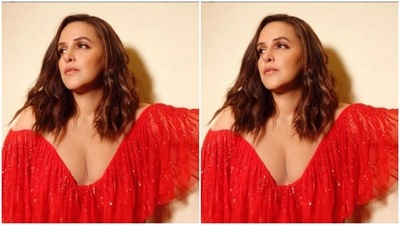The gown came with a V-neckline and frill details. The gown was intricately decorated in shiny silver resham threads and gave major party vibes to her picture. (Instagram/@nehadhupia)