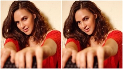 Styled by fashion stylist Aastha Sharma, Neha wore her shoulder-length tresses open in wavy curls with a side part. (Instagram/@nehadhupia)