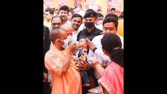 Chief minister Yogi Adityanath administering polio drops to children below five years of age in Gorakhpur while launching a statewide pulse polio campaign, on Sunday. (HT PHOTO)