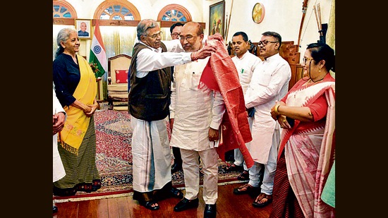Governor La Ganesan felicitates chief minister N Biren Singh in presence of Union finance minister Nirmala Sitharaman, during the BJP legislative party meeting in Imphal on Sunday. (ANI)