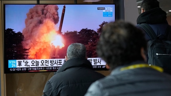 People in Seoul watch a news showing a file image of North Korea's rocket launch,&nbsp;(AP)