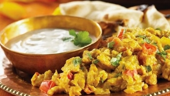 Akoori: Akoori is Parsi community's version of scrambled eggs and is commonly cooked as breakfast. Onions, tomatoes, coriander seeds, cumin seeds, fennel seeds, garlic and ginger paste is added to eggs for this recipe. People also like to have it with toast.(Pinterest)