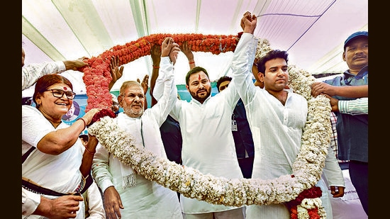 LJD leader Sharad Yadav and RJD leader Tejashwi Yadav during an event in New Delhi on Sunday. (PTI)