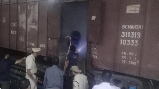 The staff of Ludhiana reailway station drove the goods train to an outer area to avoid mishap at the station, showered water inside the train and also used the fire extinguishers to control the smoke. (HT PHOTO)