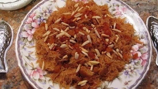 Parsi Sev: A festival or special occasion is not complete without a dessert and on Navroz Parsis love to cook Sevaiyyan. Vermicelli and dry fruits like almonds, raisins etc are roasted in ghee in a wok and a sugar syrup flavoured with nutmeg and cardamom is added to it.(Pinterest/parsicuisine.com)