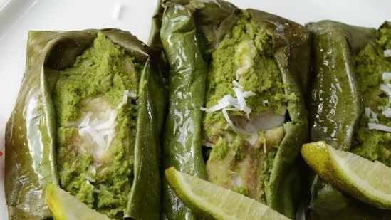 Patra Ni Machi: In this recipe, the fish is quoted with rich green chutney made of fresh mint and coriander leaves, garlic, coconut, green chilli, cumin seeds, lemon juice, wrapped in banana leaf, and steamed.(YouTube)