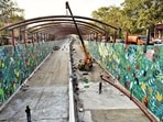 PWD officials said work on fixing ramp covers was still going on at the Ashram underpass. They said it will now be done during the night. (Sanchit Khanna/HT photo) PWD officials said work on fixing ramp covers was still going on at the Ashram underpass. They said it will now be done during the night. (Sanchit Khanna/HT photo)