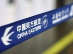 The logo of China Eastern Airlines at Beijing Capital International Airport in Beijing, China March 21, 2022. REUTERS/Tingshu Wangvv
