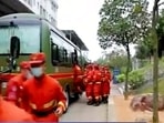In this image taken from video footage run by China's CCTV, emergency personnel prepare to travel to the site of a plane crash near Wuzhou. In this image taken from video footage run by China's CCTV, emergency personnel prepare to travel to the site of a plane crash near Wuzhou.