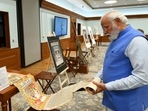 Prime Minister Narendra Modi inspects antiquities that have returned from Australia, in New Delhi, Monday. (ANI)