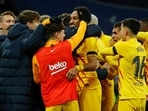 FC Barcelona's Pierre-Emerick Aubameyang celebrates scoring their fourth goal with teammates against Real Madrid.