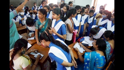 Students appearing for the UP Board examination collecting their admit card for the Uttar Pradesh Board of Secondary Education, in Prayagraj on Monday. (Agency )