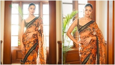 Alia Bhatt has garnered a lot of praise for her performance in the film Gangubai Kathiawadi. The actor is now gearing up for another big release, SS Rajamouli's RRR. In the past few months, Alia was spotted quite a number of times in stylish designer sarees which she wore to film promotions. In her most recent photos shared by the official Instagram handle of designer Sabyasachi, the actor can be seen redefining elegance in an orange organza floral saree. (Instagram/@sabyasachiofficial) Alia Bhatt has garnered a lot of praise for her performance in the film Gangubai Kathiawadi. The actor is now gearing up for another big release, SS Rajamouli's RRR. In the past few months, Alia was spotted quite a number of times in stylish designer sarees which she wore to film promotions. In her most recent photos shared by the official Instagram handle of designer Sabyasachi, the actor can be seen redefining elegance in an orange organza floral saree. (Instagram/@sabyasachiofficial)