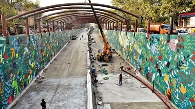 PWD officials said work on fixing ramp covers was still going on at the Ashram underpass. They said it will now be done during the night. (Sanchit Khanna/HT photo) PWD officials said work on fixing ramp covers was still going on at the Ashram underpass. They said it will now be done during the night. (Sanchit Khanna/HT photo)