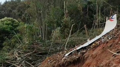 Debris of a Chinese passenger plane that was carrying 132 people when it crashed in China's Guangxi province on Monday. (Credit: @CGTNOfficial) (@CGTNOfficial)