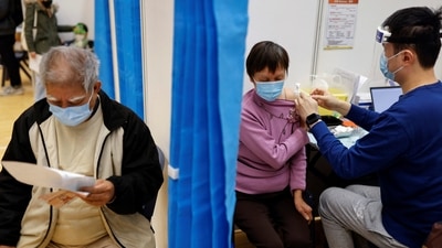 An elderly woman receives a dose of Sinovac Biotech's CoronaVac COVID-19 vaccine. (REUTERS)