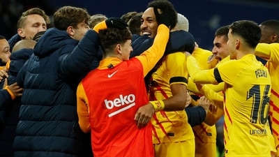 FC Barcelona's Pierre-Emerick Aubameyang celebrates scoring their fourth goal with teammates against Real Madrid. (Reuters)