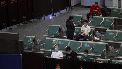 People sit in a temporarily cordoned off area for the relatives of the victims aboard China Eastern’s flight MU5735, in Guangzhou Baiyun International Airport in Guangzhou, capital of south China's Guangdong Province, on Monday. (AP)