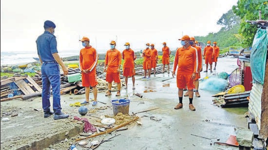 NDRF and police personnel at low lying areas of fishermen village, ahead of the landfall of Cyclone Asani, in Andaman and Nicobar Islands on Monday. (PTI)